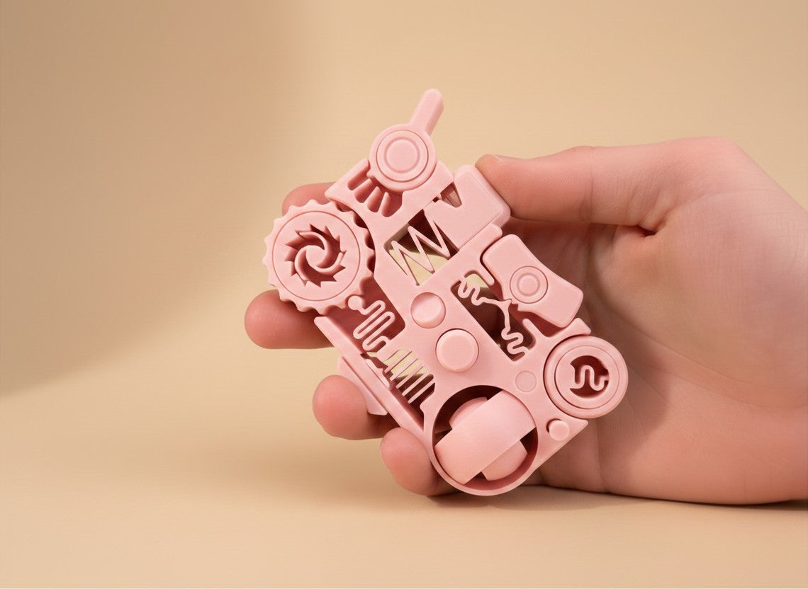 Juguete antiestrés RO de Illa Home en color rosa, dispositivo táctil 12 en 1 de bolsillo fabricado en PLA y PETG.